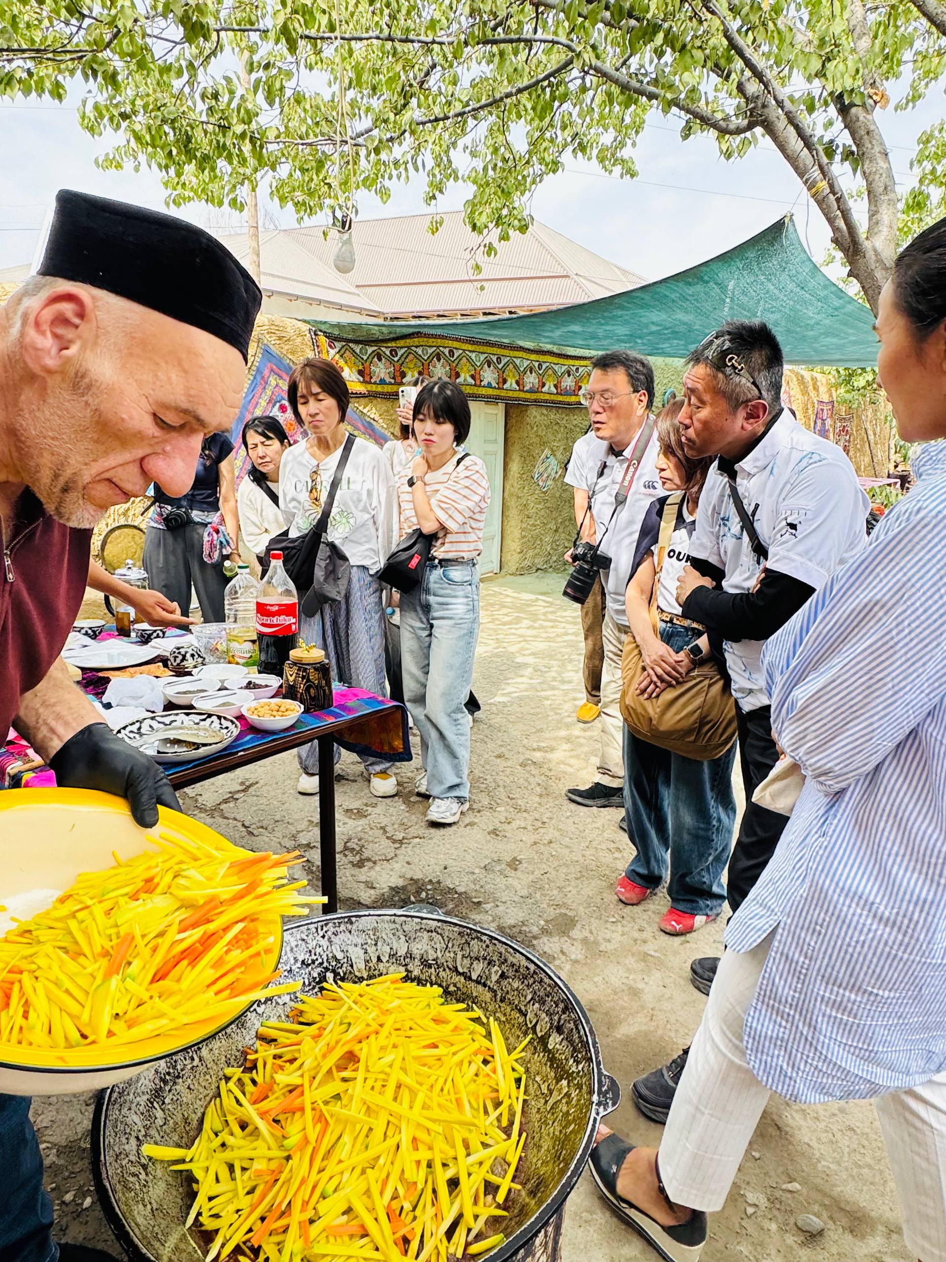 Chef Adding Carrots to Qozon