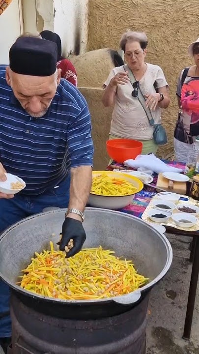 Master Chef preparing traditional plov